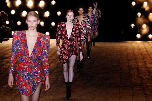 Models present creations by designer Anthony Vaccarello as part of his Autumn/Winter 2018-2019 women's ready-to-wear collection show for fashion house Saint Laurent. (REUTERS)