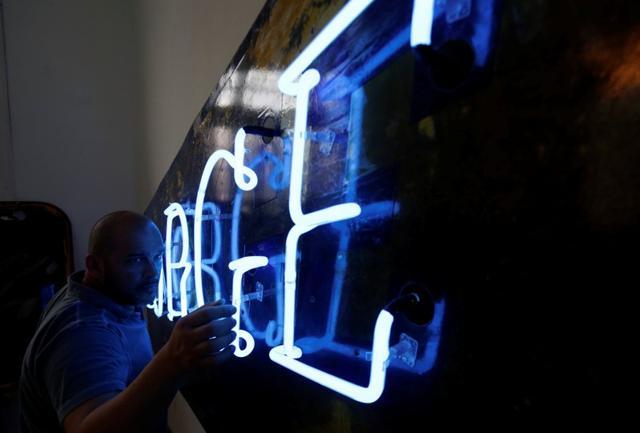 Kadir Lopez Nieves works in his workshop and gallery. (REUTERS)