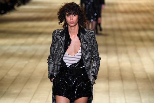 A model presents a creation for Saint Laurent during the 2018/2019 Fall/Winter collection. (AFP)