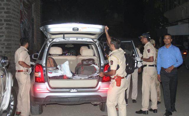 Police inspect the car in which Thakkar shot himself at Marine Drive on Tuesday. (Bhushan Koyande/HT Photo) Police inspect the car in which Thakkar shot himself at Marine Drive on Tuesday. (Bhushan Koyande/HT Photo)