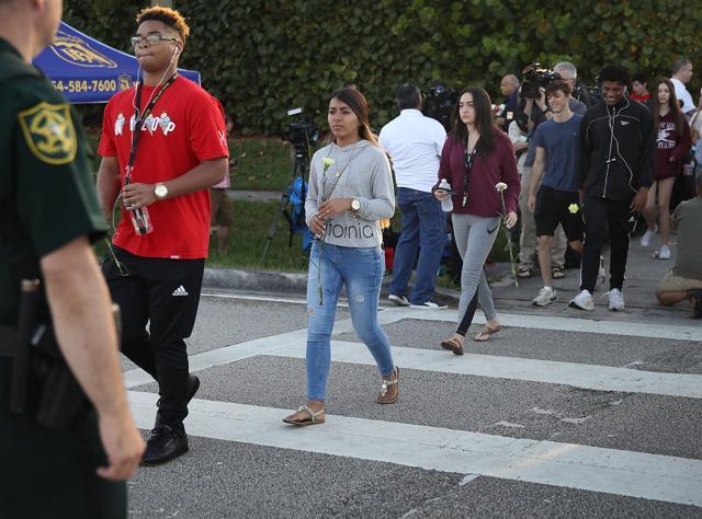 Students cross as they arrive to attend Marjory Stoneman Douglas High School for the first time since the shooting on February 28. (AFP Photo) Students cross as they arrive to attend Marjory Stoneman Douglas High School for the first time since the shooting on February 28. (AFP Photo)