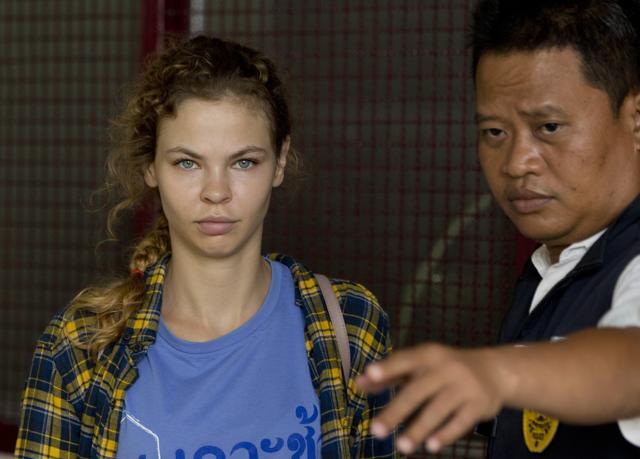 A police officer escorts Anastasia Vashukevich from a detention center in Pattaya, south of Bangkok. (AP) A police officer escorts Anastasia Vashukevich from a detention center in Pattaya, south of Bangkok. (AP)