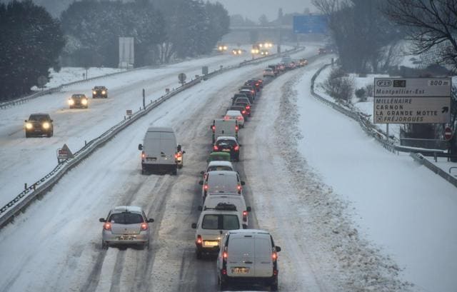 Traffic in the snow on the A9 motorway near Montpellier in south of France. (AFP) Traffic in the snow on the A9 motorway near Montpellier in south of France. (AFP)
