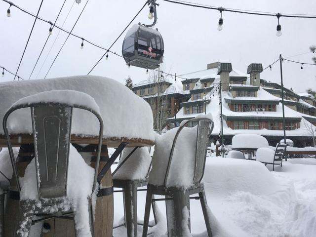 In this photo provided by the Heavenly Mountain Resort, fresh snow covers most of a table and chairs Friday, March 2, 2018, in South Lake Tahoe, California. (AP)