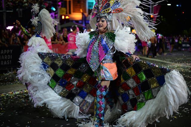 Rainbow colours beamed from faces and floats parading through Sydney. (AFP/Saeed Khan) Rainbow colours beamed from faces and floats parading through Sydney. (AFP/Saeed Khan)