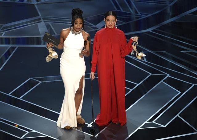 Tiffany Haddish (left) wore an ivory dress that she described as an “Eritrean authentic princess dress”. (AP) Tiffany Haddish (left) wore an ivory dress that she described as an “Eritrean authentic princess dress”. (AP)