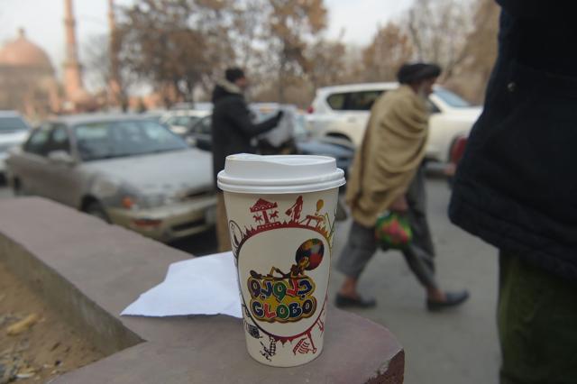 A coffee cup sold by Najibullah Sharyari from his cart in Kabul. (AFP)