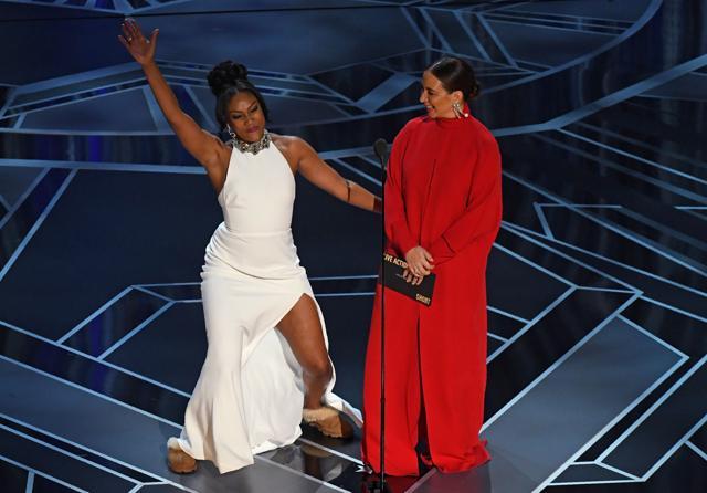 Comedian Tiffany Haddish (L) and Maya Rudolph present during the 90th Annual Academy Awards. (AFP)