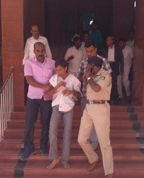 Accused Tejas Sharma being taken out of the Karnataka lokayukta’s office in Bengaluru on Wednesday. (ANI Twitter) Accused Tejas Sharma being taken out of the Karnataka lokayukta’s office in Bengaluru on Wednesday. (ANI Twitter)