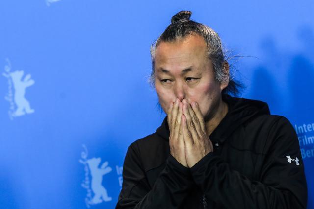Director Kim Ki-duk poses at the photo-call on the film 'Human, Space, Time and Human' during the 68th edition of the International Film Festival Berlin, Berlinale, in Berlin. (AP) Director Kim Ki-duk poses at the photo-call on the film 'Human, Space, Time and Human' during the 68th edition of the International Film Festival Berlin, Berlinale, in Berlin. (AP)