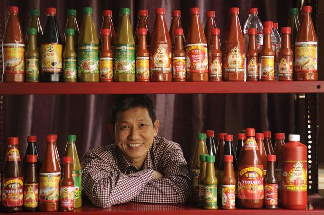 Owner of the Pou Chong brand, Dominic Lee at his shop at Tiretta Bazaar, the first Chinatown. The combination of the Pou Chong tomato and Pou Chong green chilli sauce is usually used with the Kolkata kathi roll. (Samir Jana/HT PHOTO) Owner of the Pou Chong brand, Dominic Lee at his shop at Tiretta Bazaar, the first Chinatown. The combination of the Pou Chong tomato and Pou Chong green chilli sauce is usually used with the Kolkata kathi roll. (Samir Jana/HT PHOTO)