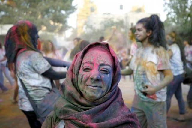 A Palestinian reveller participates in a Holi celebration organised by Palestinian activists in the West Bank city of Ramallah. A Palestinian reveller participates in a Holi celebration organised by Palestinian activists in the West Bank city of Ramallah.