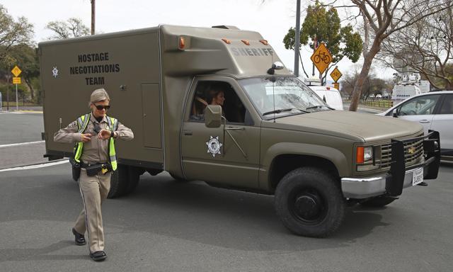 A sheriff's hostage negotiation team passes a California highway patrol checkpoint at the Veterans Home of California in Yountville, Calif., Friday, March 9, 2018. (AP)