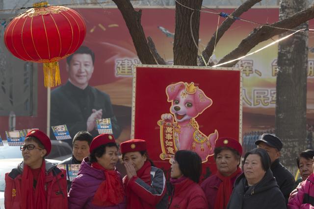 Residents celebrate lantern festival to mark the end of winter near a mural depicting Chinese President Xi Jinping in a residential compound for retired soldiers in Beijing. (AP Photo) Residents celebrate lantern festival to mark the end of winter near a mural depicting Chinese President Xi Jinping in a residential compound for retired soldiers in Beijing. (AP Photo)
