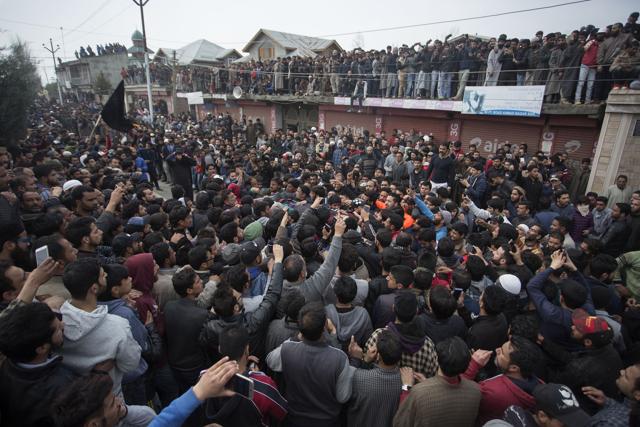 People shout slogans near the body of slain militant Eesa Fazili during his funeral procession in Srinagar on Monday. (Waseem Andrabi /HT Photo) People shout slogans near the body of slain militant Eesa Fazili during his funeral procession in Srinagar on Monday. (Waseem Andrabi /HT Photo)