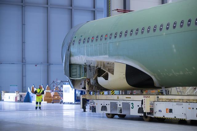 The assembled fuselage of an Airbus A320 narrow-body passenger twin-engine jet airliner moves across the Airbus SE factory floor in Hamburg, Germany. (Krisztian Bocsi/Bloomberg) The assembled fuselage of an Airbus A320 narrow-body passenger twin-engine jet airliner moves across the Airbus SE factory floor in Hamburg, Germany. (Krisztian Bocsi/Bloomberg)