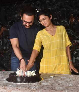 Aamir Khan cuts his birthday cake. (PTI) Aamir Khan cuts his birthday cake. (PTI)