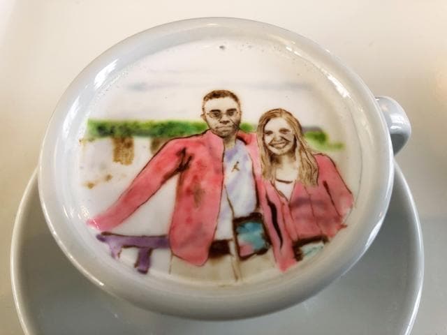 A couple's Niagara Falls vacation photo recreated atop a cup of cold java by Barista Lee Kang Bin. (AP)