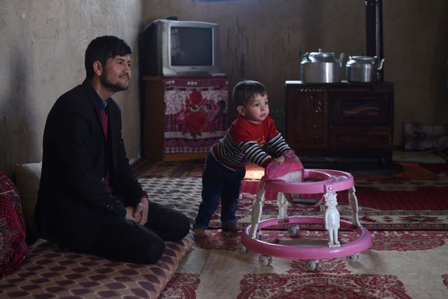 This picture taken on March 16, 2018 shows Afghan father Sayed Assadullah Pooya, 28, looking on alongside his son Donald Trump, aged around 18 months, during an interview with AFP at their home in Kabul. (AFP) This picture taken on March 16, 2018 shows Afghan father Sayed Assadullah Pooya, 28, looking on alongside his son Donald Trump, aged around 18 months, during an interview with AFP at their home in Kabul. (AFP)