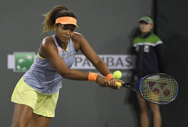 Naomi Osaka, of Japan, returns a shot against Simona Halep, of Romania, during the semifinals at the BNP Paribas Open tennis tournament, Friday, March 16, 2018, in Indian Wells, California. (AP) Naomi Osaka, of Japan, returns a shot against Simona Halep, of Romania, during the semifinals at the BNP Paribas Open tennis tournament, Friday, March 16, 2018, in Indian Wells, California. (AP)