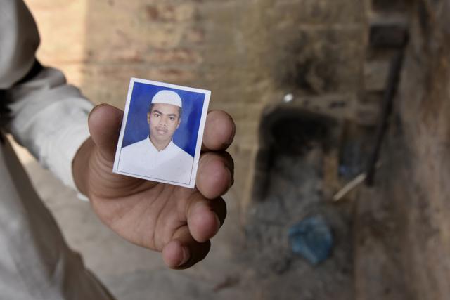 A person holds a photo of Junaid, who was murdered after a scuffle on a train. (Raj K Raj/HT PHOTO) A person holds a photo of Junaid, who was murdered after a scuffle on a train. (Raj K Raj/HT PHOTO)