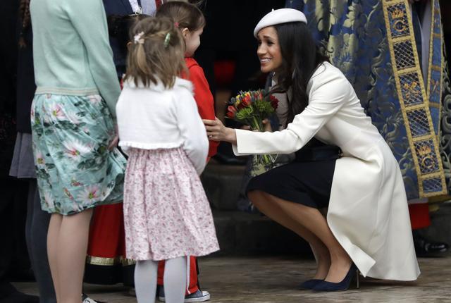 US actress Meghan Markle (R), fiancee of Britain's Prince Harry receives a posy of flowers from a young girl after attending a Commonwealth Day Service at Westminster Abbey in central London, on March 12, 2018. (AFP) US actress Meghan Markle (R), fiancee of Britain's Prince Harry receives a posy of flowers from a young girl after attending a Commonwealth Day Service at Westminster Abbey in central London, on March 12, 2018. (AFP)