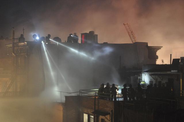Firefighters work at the scene of an overnight fire that began on March 22, 2018, in the Harlem neighbourhood of New York. Firefighter Michael R. Davidson of Engine Company 69, died after he became separated from his unit as they battled the fierce, smoky blaze that broke out in the basement of a former Harlem jazz club being used as a film set for ‘Motherless Brooklyn’, directed by Edward Norton. (AP) Firefighters work at the scene of an overnight fire that began on March 22, 2018, in the Harlem neighbourhood of New York. Firefighter Michael R. Davidson of Engine Company 69, died after he became separated from his unit as they battled the fierce, smoky blaze that broke out in the basement of a former Harlem jazz club being used as a film set for ‘Motherless Brooklyn’, directed by Edward Norton. (AP)
