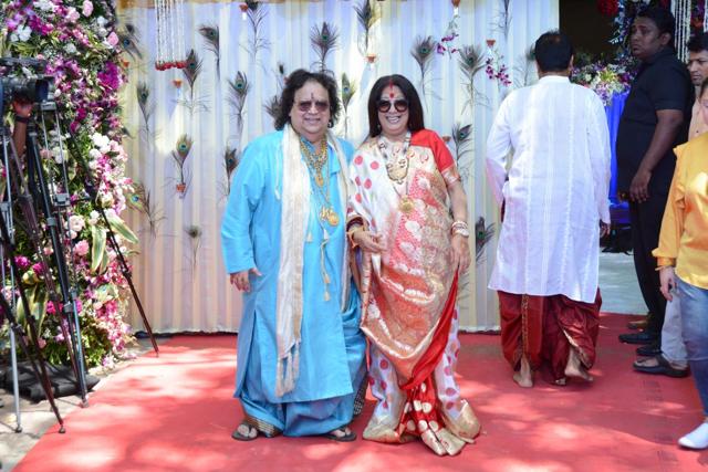 Music composer Bappi Lahiri along with his wife Chitrani during annaprasanna ceremony of their grandson. (IANS)