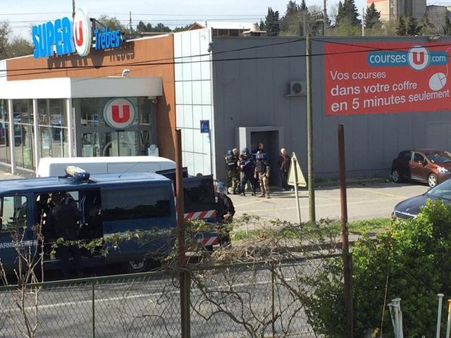 Police at the scene of a hostage situation in a supermarket in Trebes on Friday, in this picture obtained from a social media video. (REUTERS) Police at the scene of a hostage situation in a supermarket in Trebes on Friday, in this picture obtained from a social media video. (REUTERS)