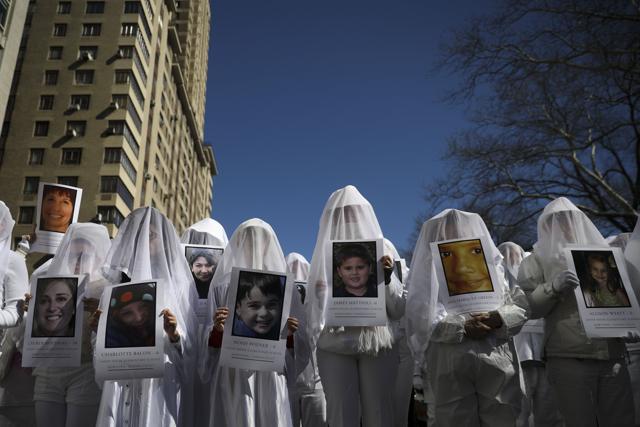 Protestors, including the group Gays Against Guns, attend the March For Our Lives just north of Columbus Circle, in New York City. (AFP) Protestors, including the group Gays Against Guns, attend the March For Our Lives just north of Columbus Circle, in New York City. (AFP)