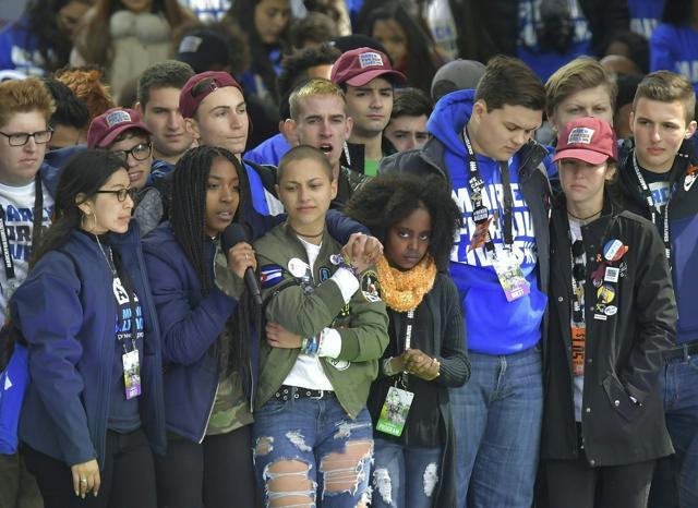 Marjory Stoneman Douglas High School student Emma Gonzalez (C) and other students on stage embrace during the March for Our Lives Rally in Washington, DC. (AFP) Marjory Stoneman Douglas High School student Emma Gonzalez (C) and other students on stage embrace during the March for Our Lives Rally in Washington, DC. (AFP)
