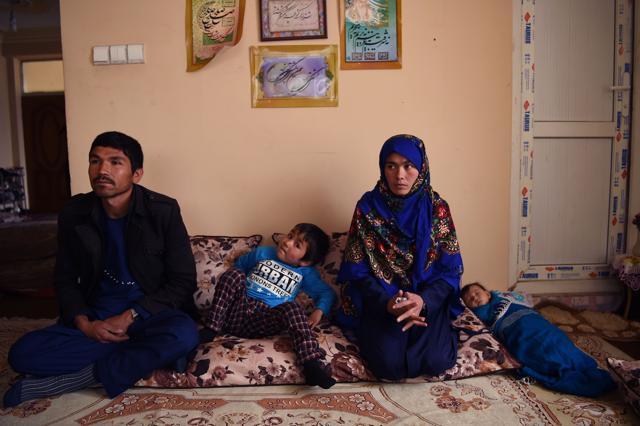 Jahantab Ahmadi 25, sitting next to two of her children during an interview as her husband Musa Mohammadi (L) looks on, at a house in Kabul. (AFP) Jahantab Ahmadi 25, sitting next to two of her children during an interview as her husband Musa Mohammadi (L) looks on, at a house in Kabul. (AFP)