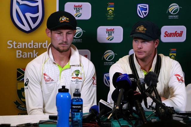 This video grab taken from a footage released by AFP TV shows Australia's captain Steve Smith (R), flankled by teammate Cameron Bancroft, speaking during a press conference in Cape Town, on March 24, 2018 as he admitted to ball-tampering during the third Test against South Africa. (AFP) This video grab taken from a footage released by AFP TV shows Australia's captain Steve Smith (R), flankled by teammate Cameron Bancroft, speaking during a press conference in Cape Town, on March 24, 2018 as he admitted to ball-tampering during the third Test against South Africa. (AFP)
