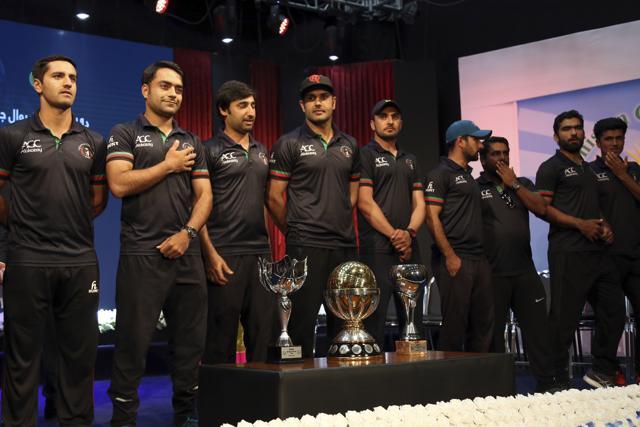 Afghanistan's cricket players stand near their trophies. (AP) Afghanistan's cricket players stand near their trophies. (AP)