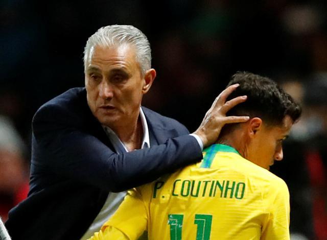 Brazil's Philippe Coutinho with coach Tite as he is substituted off. (REUTERS) Brazil's Philippe Coutinho with coach Tite as he is substituted off. (REUTERS)