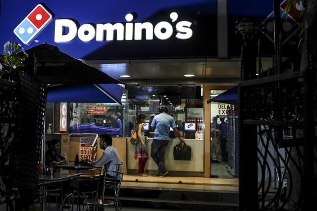 Customers wait at a counter of a Domino's Pizza Inc. restaurant, operated by Jubilant Foodworks Ltd., in Mumbai. (Dhiraj Singh/Bloomberg) Customers wait at a counter of a Domino's Pizza Inc. restaurant, operated by Jubilant Foodworks Ltd., in Mumbai. (Dhiraj Singh/Bloomberg)