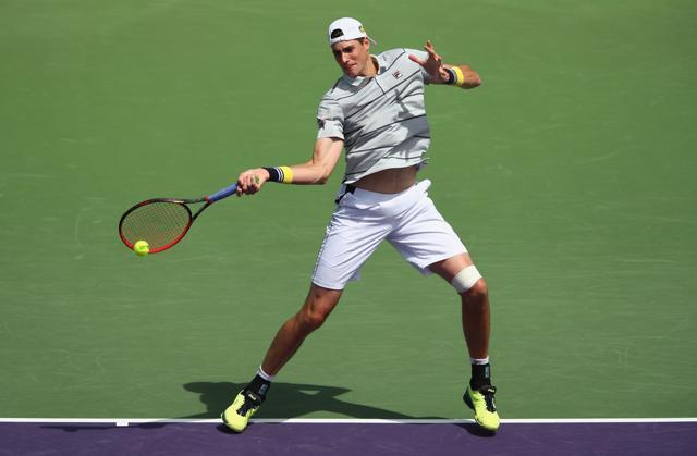 John Isner of the United States plays a forehand against Marin Cilic of Croatia. (AFP) John Isner of the United States plays a forehand against Marin Cilic of Croatia. (AFP)