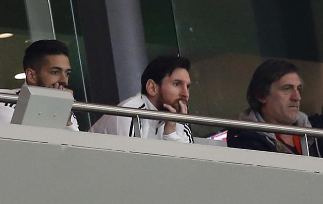 Argentina's Lionel Messi, center, watches from the tribune during the international friendly against Spain. (AP) Argentina's Lionel Messi, center, watches from the tribune during the international friendly against Spain. (AP)