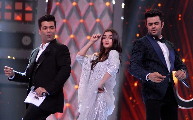 Indian Bollywood director Karan Johar (L) and actors Alia Bhatt (C) and Manish Paul take part in the Umang Mumbai Police Show 2018 in Mumbai. (AFP) Indian Bollywood director Karan Johar (L) and actors Alia Bhatt (C) and Manish Paul take part in the Umang Mumbai Police Show 2018 in Mumbai. (AFP)