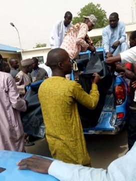 Dead bodies are brought to a hospital after a suspected Boko Haram attack on the edge of Maiduguri's inner city, Nigeria April 2, 2018. (REUTERS)