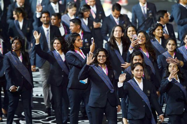 Indian athletes wave as they march past at Carrara Stadium during the opening ceremony of Commonwealth Games 2018, Gold Coast in Australia on Wednesday. (PTI) Indian athletes wave as they march past at Carrara Stadium during the opening ceremony of Commonwealth Games 2018, Gold Coast in Australia on Wednesday. (PTI)