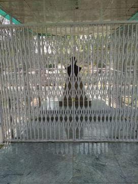 Iron grills put up around BR Ambedkar’s bust installed on the campus of the Babasaheb Bhimrao Ambedkar University. (HT Photo ) Iron grills put up around BR Ambedkar’s bust installed on the campus of the Babasaheb Bhimrao Ambedkar University. (HT Photo )
