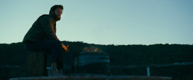 John Krasinski protects his family in A Quiet Place.