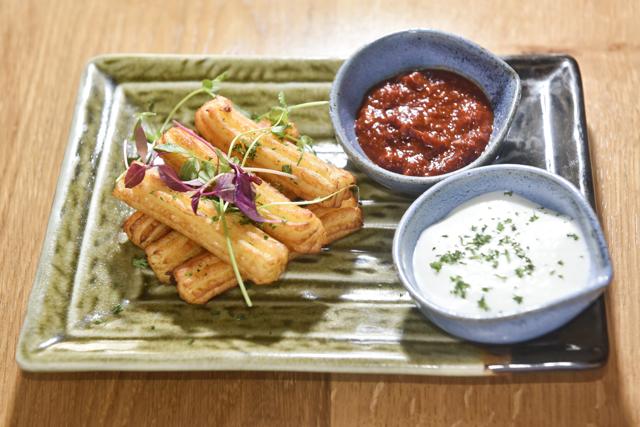 Our small plate of light, crisp goat-cheese churros with truffle cream showed us the Spanish dessert’s versatility in this savoury rendition. (Aalok Soni / HT Photo)
