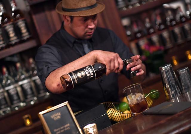 A bartender prepares a drink with Havana Club Rum. (AFP PHOTO / ANGELA WEISS)