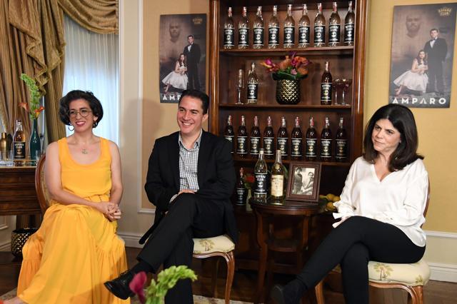 Vanessa Garcia, playwright of Amparo, Roberto Ramirez, Bacardi brand executive and Paola Arechabala Consuegra, second generation Arechabala family member, during the AFP interview. (AFP PHOTO / ANGELA WEISS)
