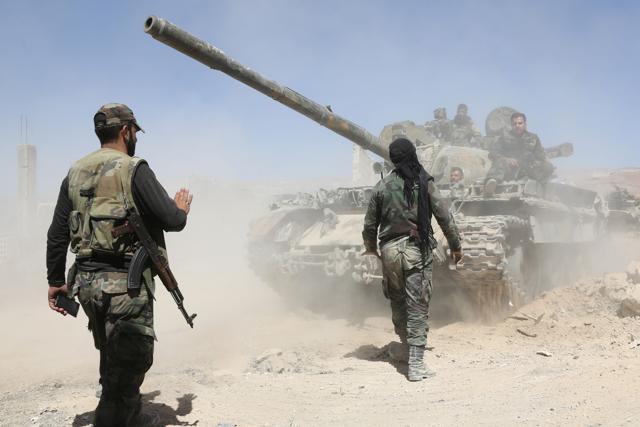Pro-Syrian regime forces seen advancing towards Douma, the last opposition holdout in Eastern Ghouta. (AFP) Pro-Syrian regime forces seen advancing towards Douma, the last opposition holdout in Eastern Ghouta. (AFP)