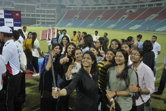 Family of the officers taking selfie on the ground. (Deepak Gupta/HT Photo)