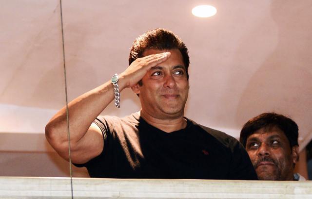 Salman Khan waves to fans after reaching home at Bandra in Mumbai. (AFP)
