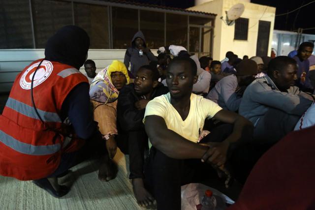 Aid workers check up on illegal migrants at a naval base in Tripoli after they were rescued off Libya's coast. (AFP/File Photo) Aid workers check up on illegal migrants at a naval base in Tripoli after they were rescued off Libya's coast. (AFP/File Photo)